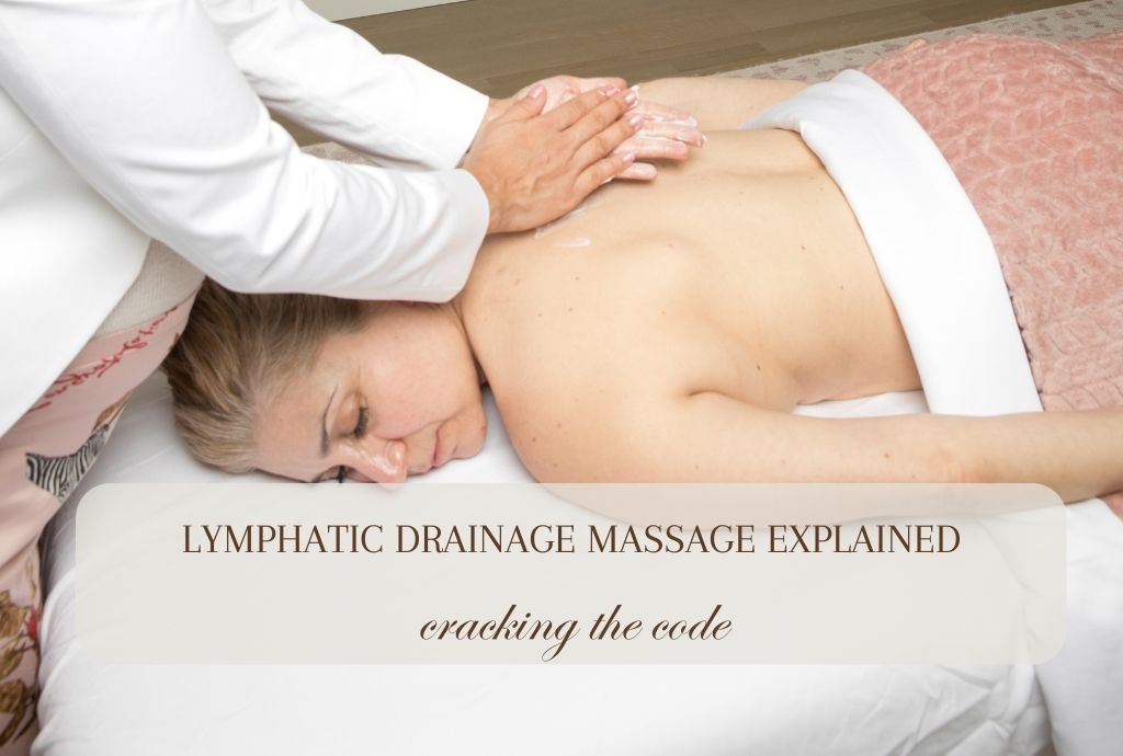 A woman laying on her stomach getting a lymphatic drainage massage.